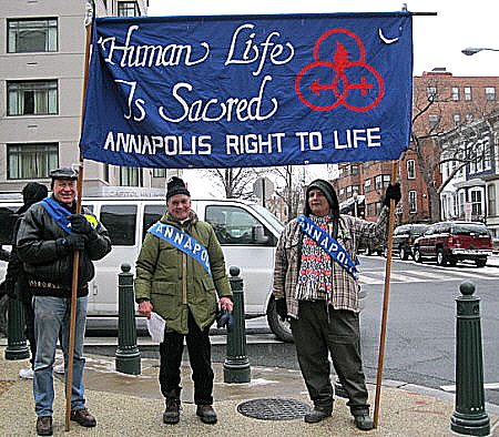 Three men with Annapolis (Md.) Right to Life Banner