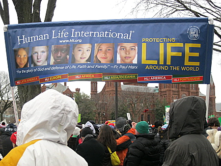 Human Life International banner shows photos of different nationalities