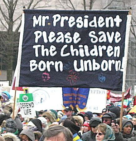 Banner pleads: 'Mr. President: Please Save The Children/Born and Unborn'