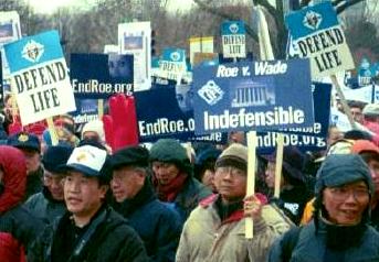 Anti-<em>Roe</em> and 'Defend Life' marchers and signs