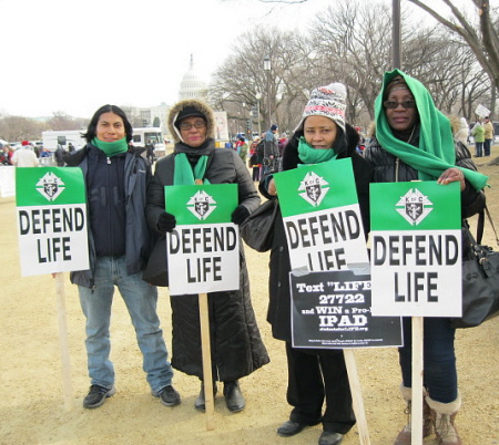 African Americans and Latinos with 'Defend Life' signs