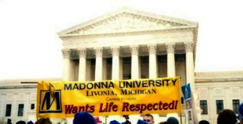 Madonna University students with their banner at the Supreme Court