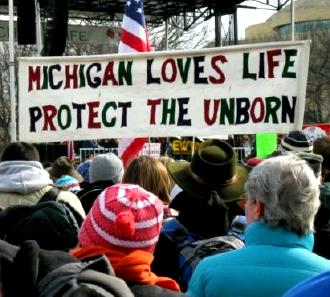 Marchers with 'Michigan Loves Life/Protect the Unborn' banner
