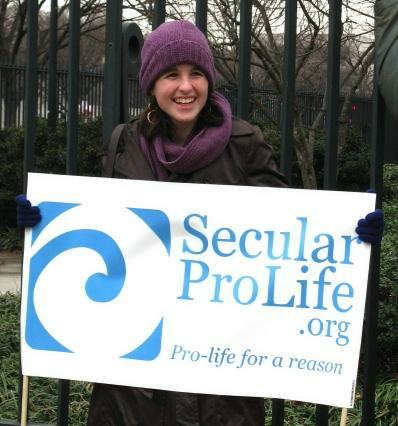 Young woman with sign for SecularProLife.org