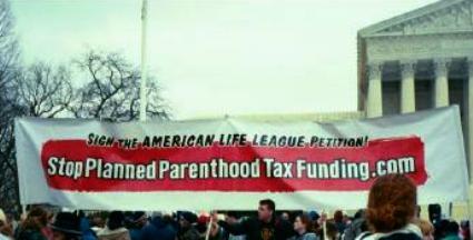 Banner on Capitol Hill calls for end to tax funding of Planned Parenthood